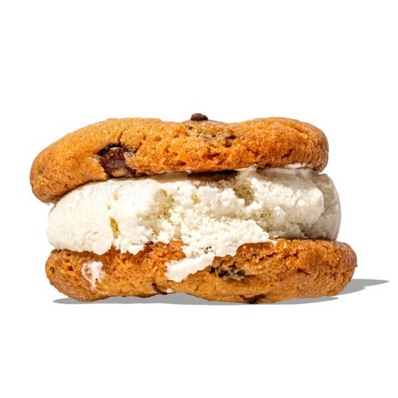 An ice cream sandwich between two cookies
