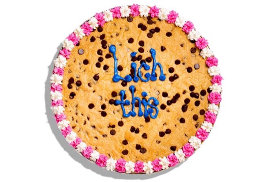 A decorated chocolate chip cookie cake