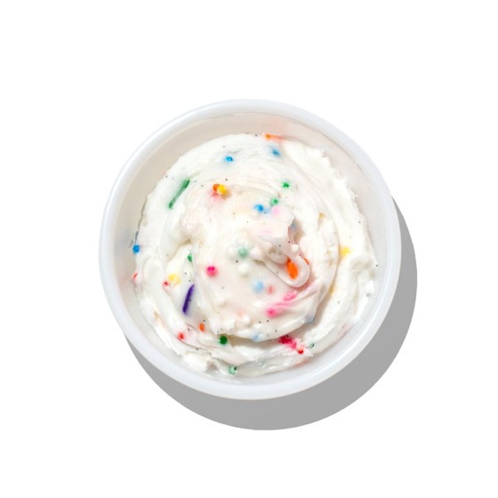 A cup of frosting for dunking