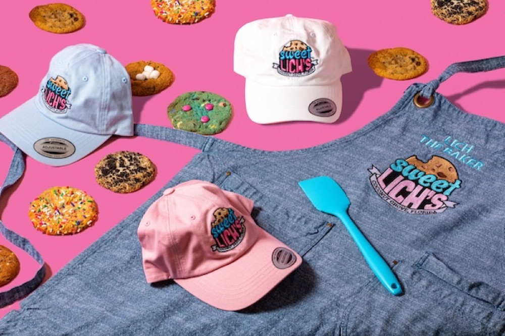 Sweet Lich's hats and apron flat lay